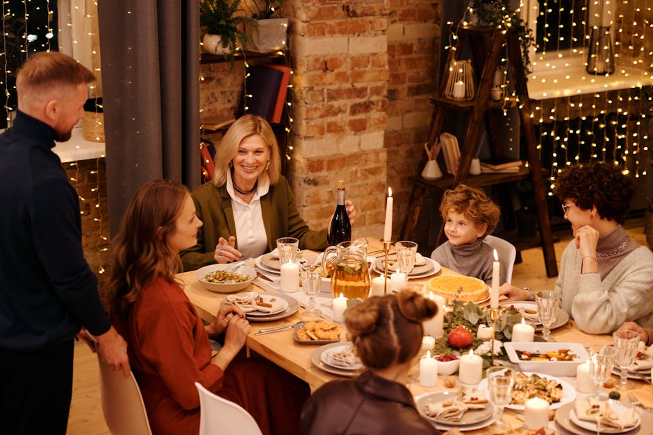 Warm family gathering enjoying Christmas dinner with festive decor and lights